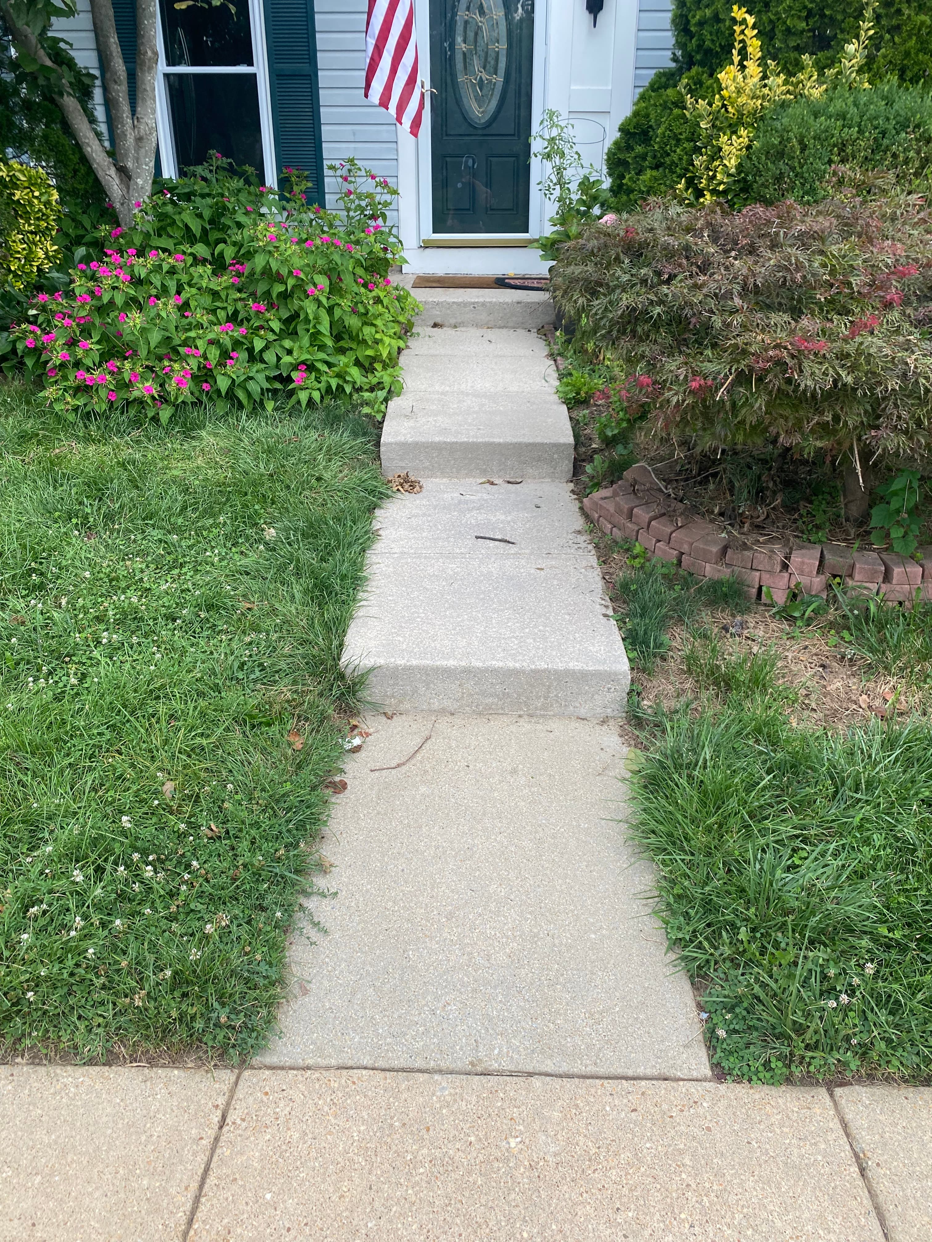 Pressure washing a concrete driveway
