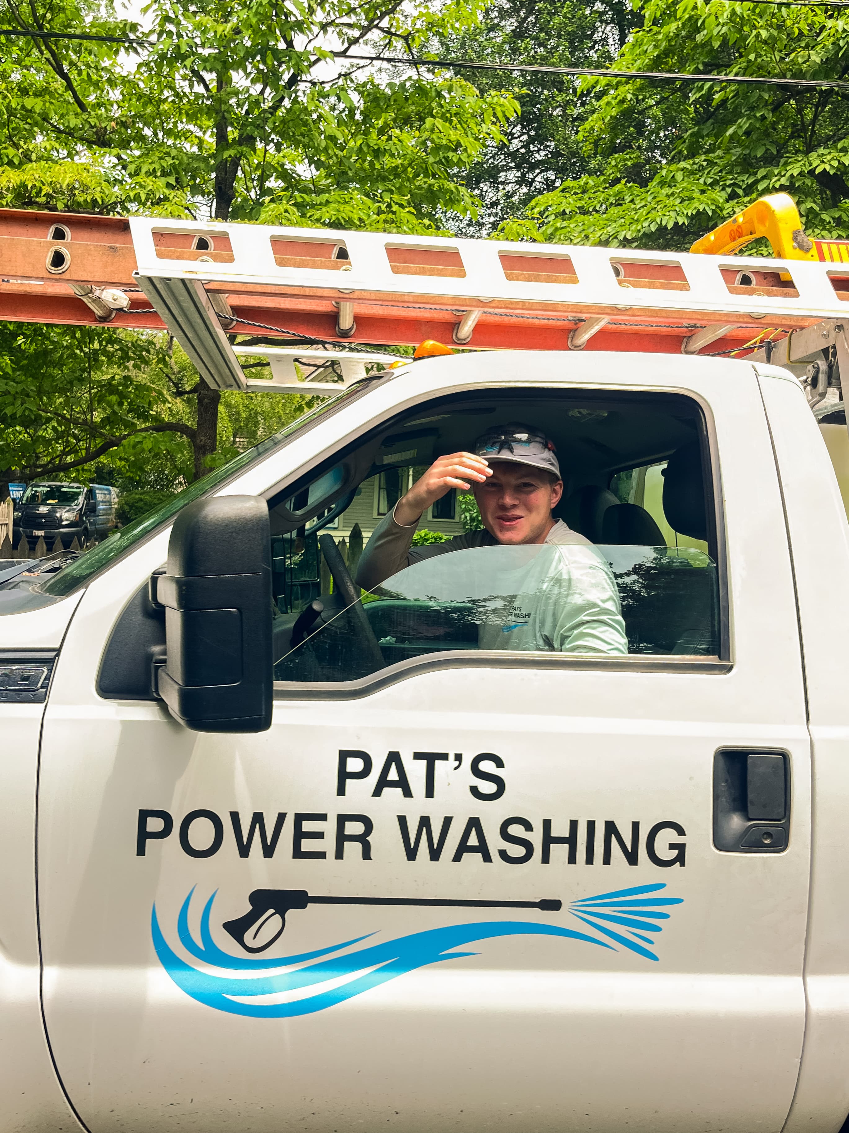 Pat power washing a client's property